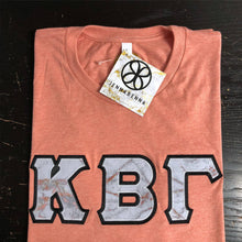 Load image into Gallery viewer, Sorority Apparel - Heather Sunset With Glitterized Goldrush Cathedral Marble On Black Twill
